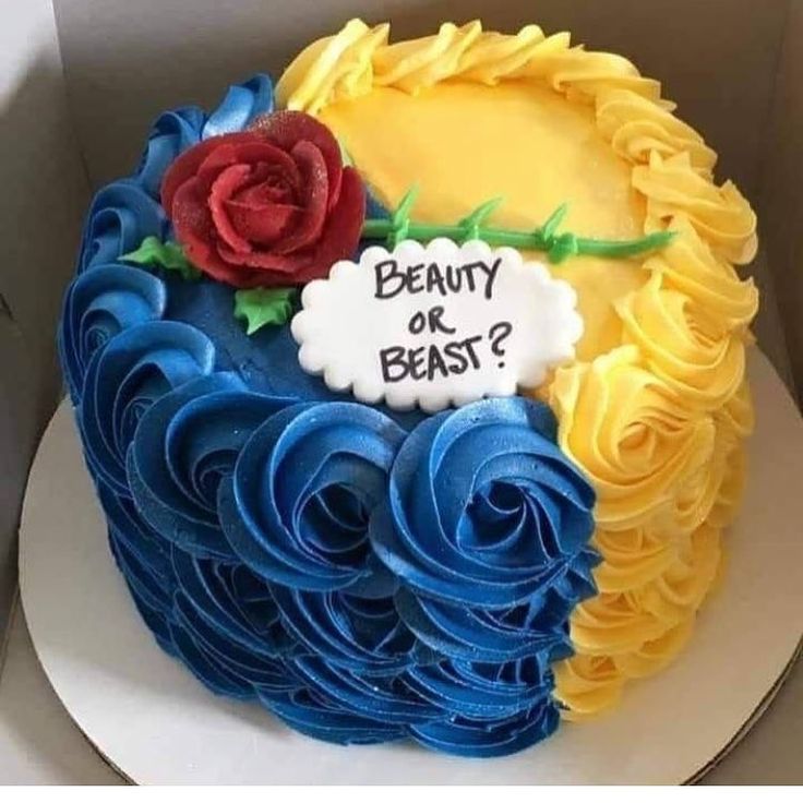 a cake with blue icing and yellow frosting in the shape of a flower