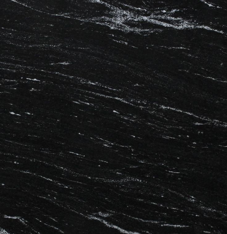 a black marble textured surface with white streaks on the top and bottom, as seen from above