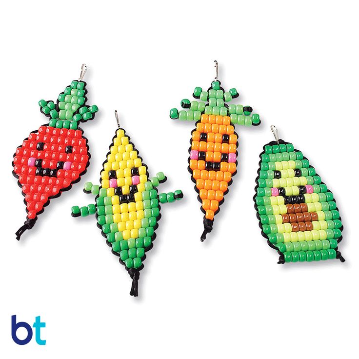 three beaded carrots hanging from hooks on a white background with the words bt