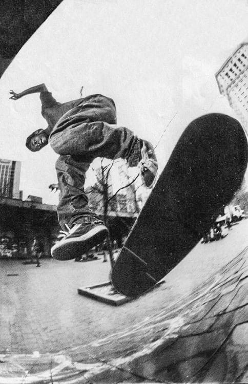 a man riding a skateboard up the side of a ramp