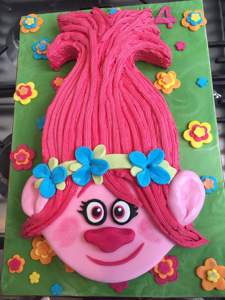 Princess Poppy Trolls Cake I like their facial features and flower headband for my cake Trolls Cupcake Cake, Trolls Cake Ideas, Poppy Trolls Cake, Princess Poppy Cake, Trolls Cakes, Troll Cake, Troll Cupcakes, Trolls Birthday Cake, Poppy Birthday