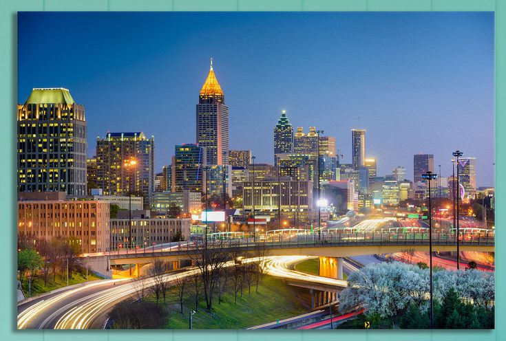 the city skyline is lit up at night in this time lapse photo with long exposure