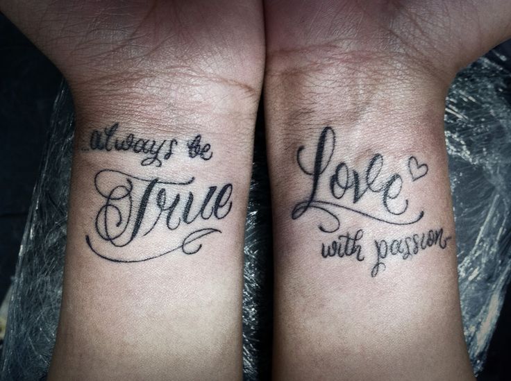 two wrist tattoos with the words love and strength written on each side of their arms