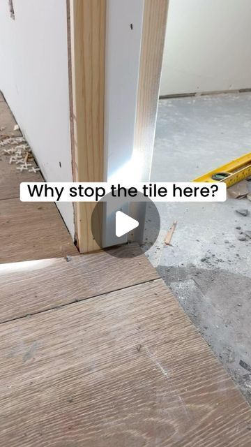 an image of a door being installed in the middle of a room with wood flooring