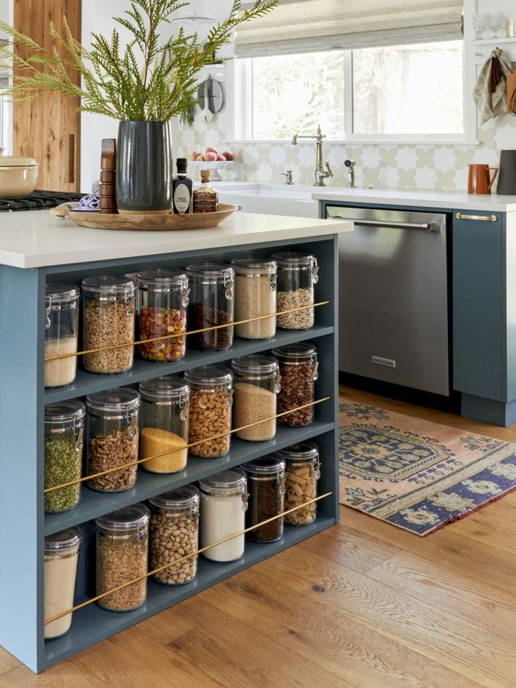 a kitchen island with spice jars on it