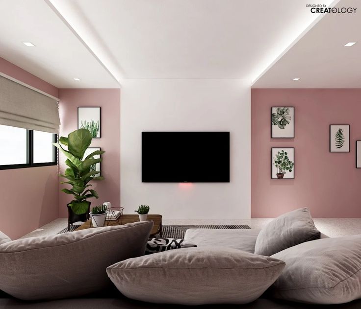 a living room filled with furniture and a flat screen tv mounted to the side of a wall