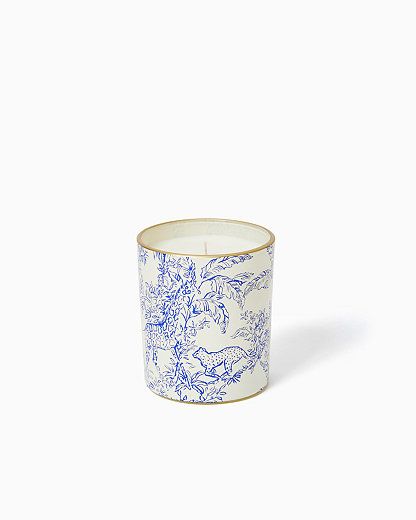 a blue and white cup with an animal design on the inside, in front of a white background