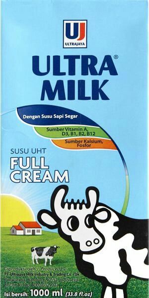 ultra milk with cow on the side and blue sky in the background, for dairy products