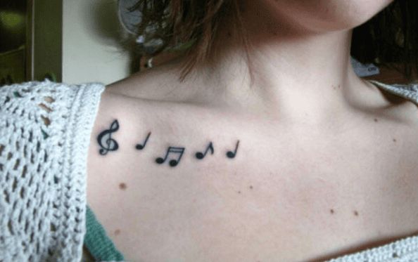 a woman with musical notes tattooed on her chest