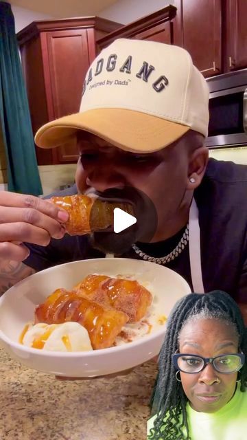 a man is eating food in a bowl with his face close to the camera, while another woman looks on