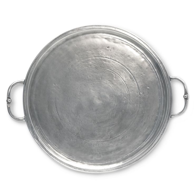 an old metal pan with handles on a white background