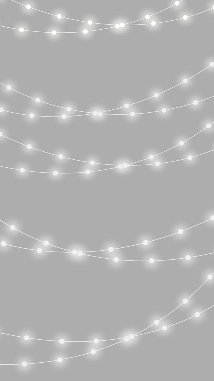 a string of white lights on a gray background