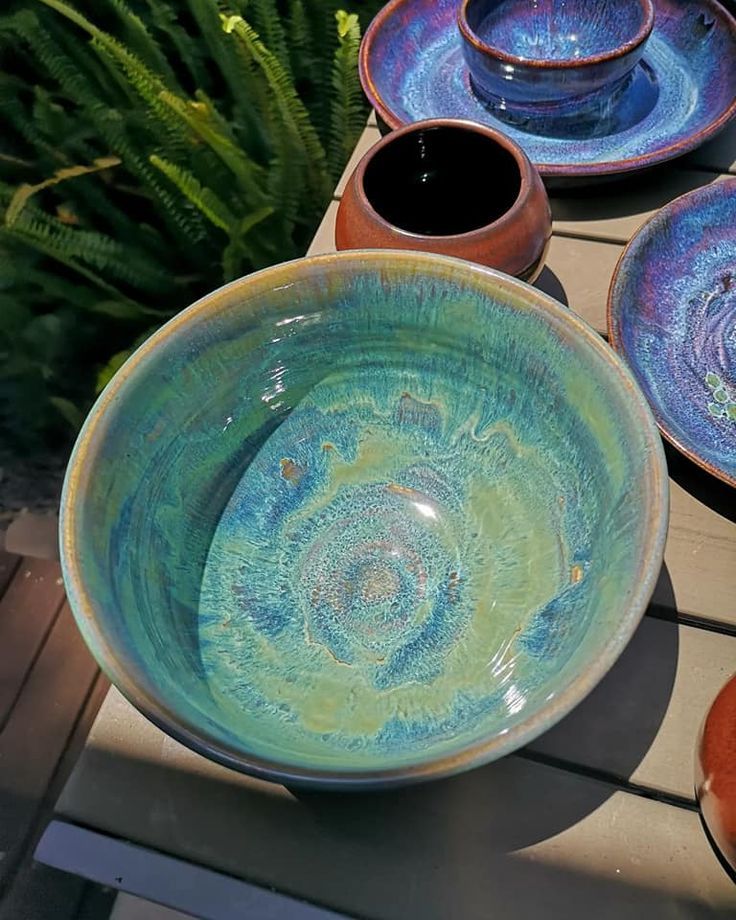 several bowls and plates are sitting on a table