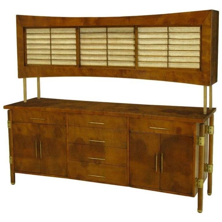 a large wooden cabinet with shutters on top