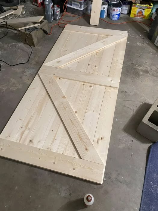 the door is being made and ready to be hung on the wall in the garage