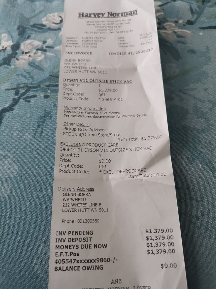 a receipt sitting on top of a bed