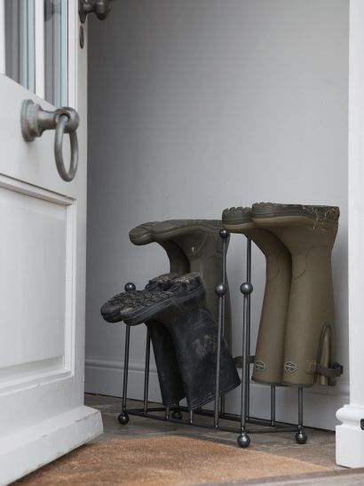 three boots are lined up in front of the door