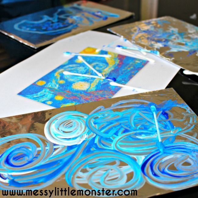 some blue and white art work on metal trays