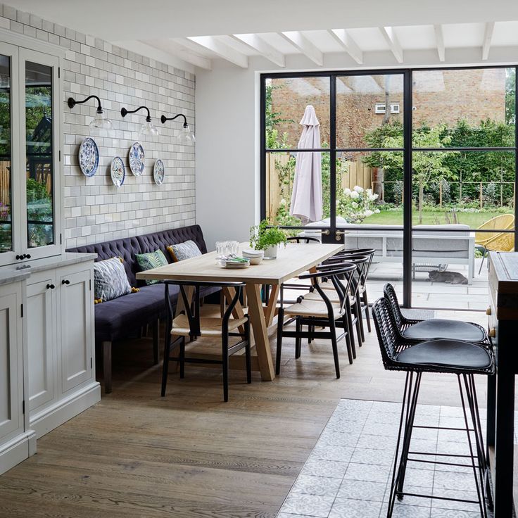 an image of a dining room setting with white brick walls