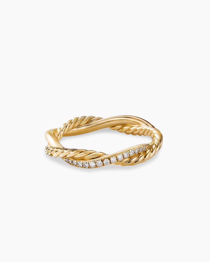 a yellow gold ring with diamonds on the sides and a twisted design in the middle