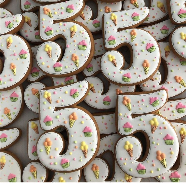 the number six cookies are decorated with icing and sprinkles