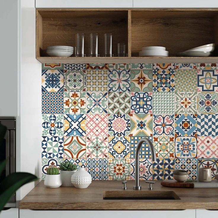 a kitchen with colorful tiles on the backsplash and wooden shelves over the sink