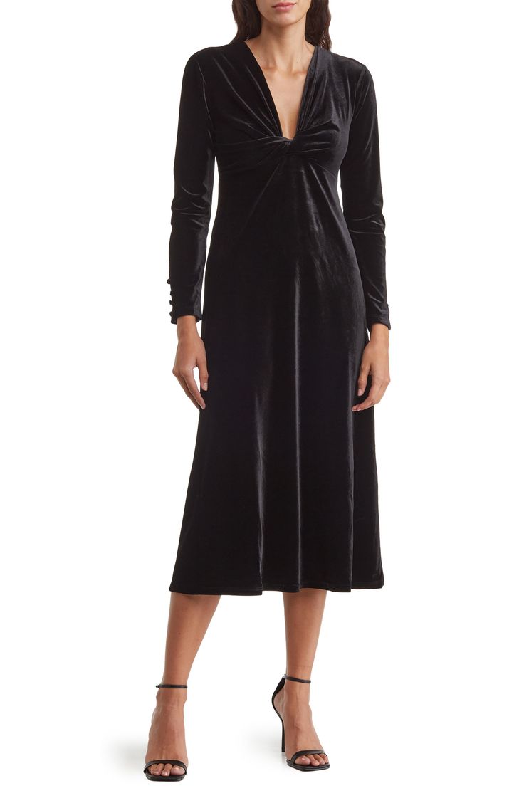 A long-sleeve midi dress cut from soft stretch velvet offers elegant style with a twisted V-neck and Empire waist. 48" length Hidden side-zip closure Deep V-neck Long sleeves with nonfunctional four-button cuffs Lined 92% polyester, 8% spandex Dry clean Imported Model stats: 5'10" height, 32" bust, 25" waist, 36" hip. Model is wearing size 4. What Is Cocktail Attire, Jewelry Enamel, Maggy London Dresses, Velvet Midi Dress, Guest Attire, Plunging Neck, Wedding Attire Guest, Cocktail Attire, Daytime Dresses