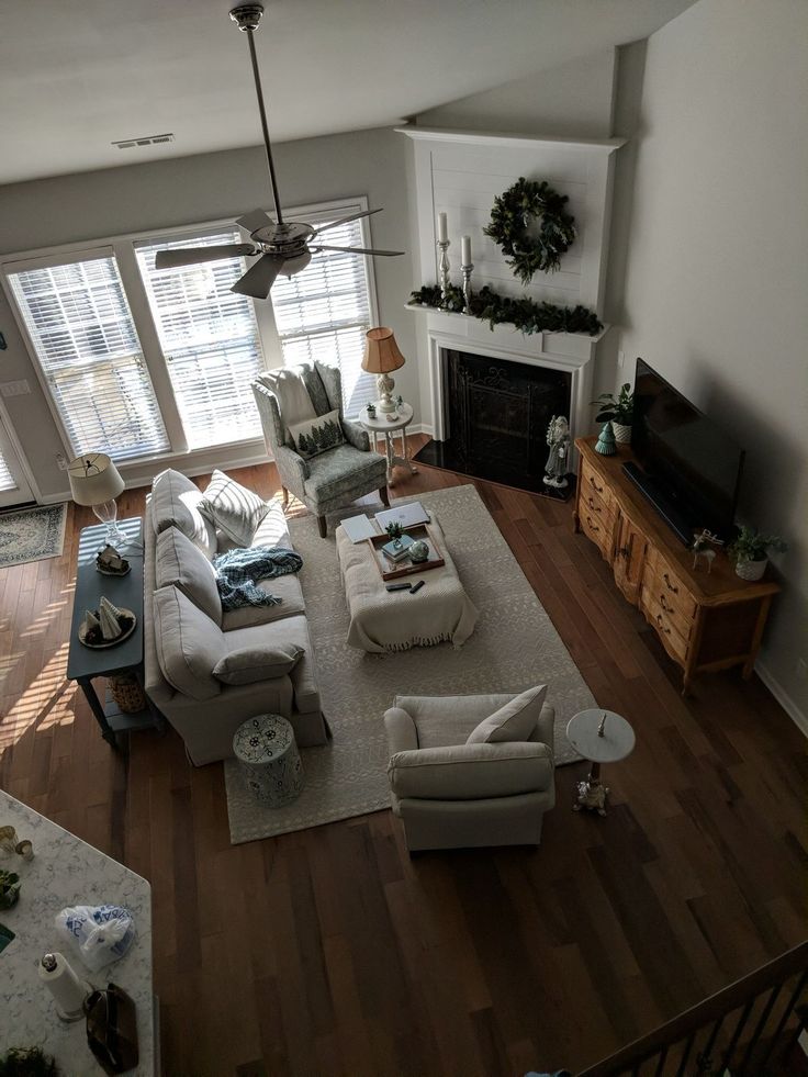 a living room filled with furniture and a fire place