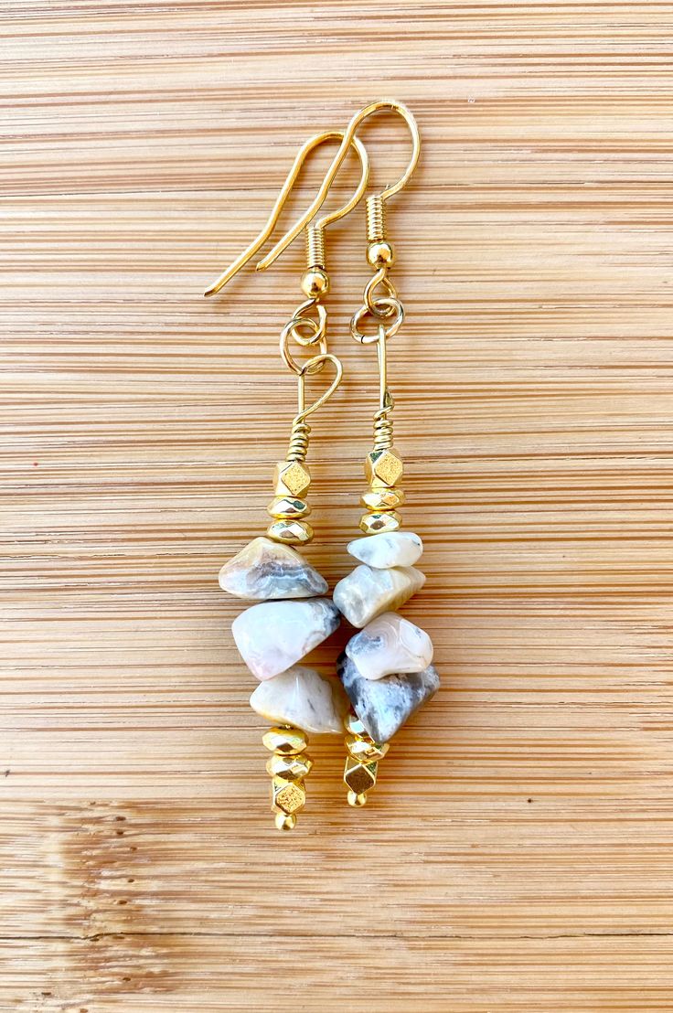 The TUSCAN SUN Crazy Lace Agate Chip Earrings were created with the lovely neutral Crazy Lace Agate chip gemstones with squared gold hematites to add a bit of uniqueness & more! These earrings are part of the 2022 POLYCHROMOS COLLECTION. Complete your look by adding the matching necklace, bracelet or loc jewel. Specifically created to match the 2022 Pieces Collection. Mix & match your jewels to enhance your outfit and exude your style! Length 1-1.5 in drop Gold Agate Gemstone Earrings, Gold Agate Earrings For Jewelry Making, Gold Agate Earrings With Natural Stones, Gold Earrings With Natural Agate Stones, Gold Agate Earrings, Chip Earrings, Blue Sodalite, Crazy Lace Agate, Lace Agate