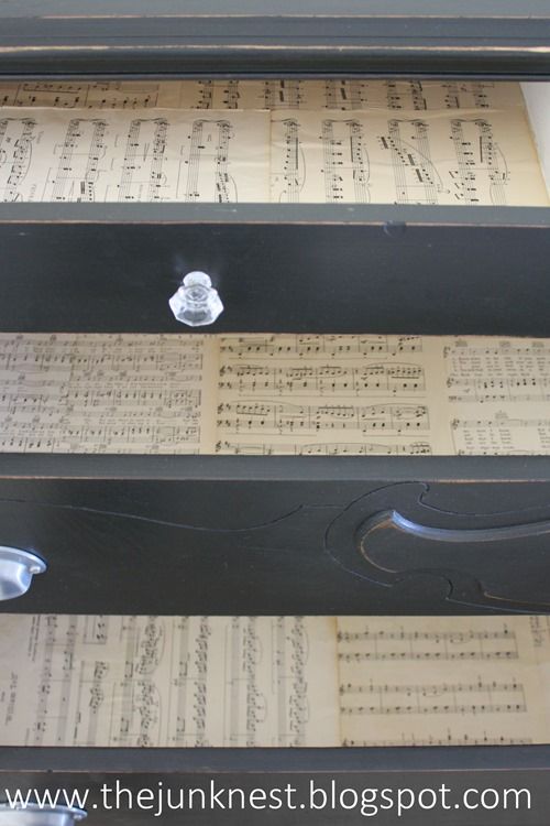 an old drawer with sheet music on it