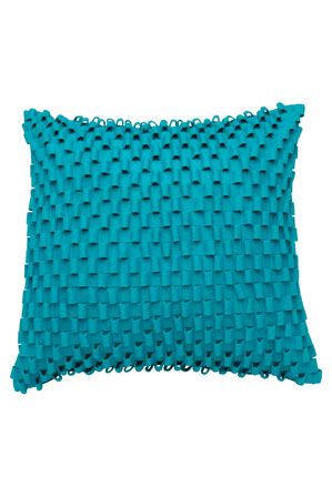 a teal pillow on a white background