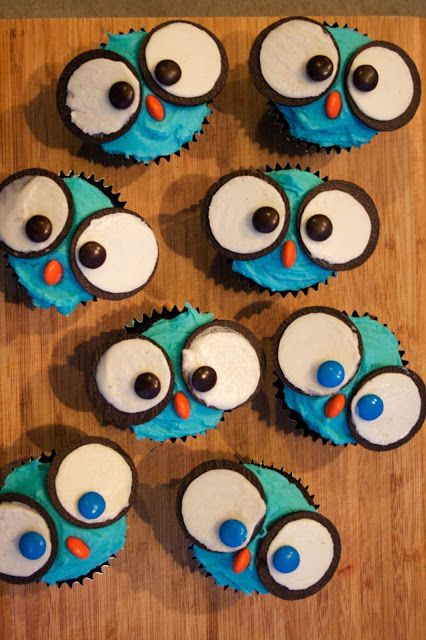 some cupcakes with blue frosting and eyes