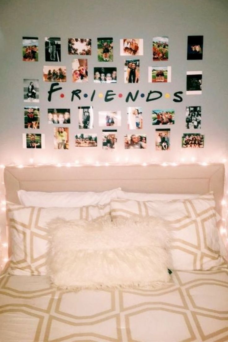 a white bed topped with lots of pictures and lights