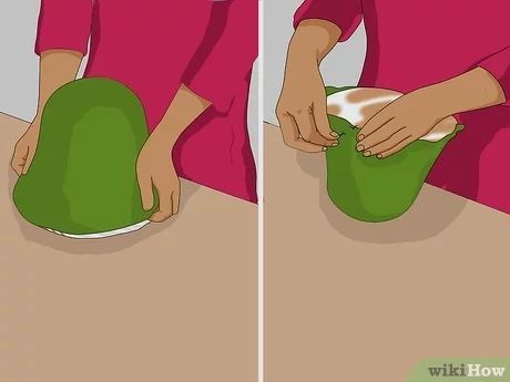 a woman is pouring something into a green bowl