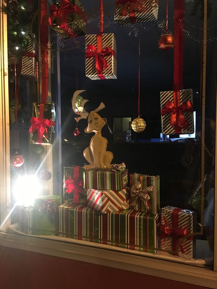 a window display with presents and lights in it