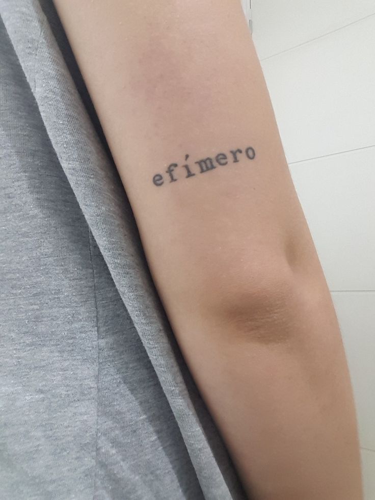 a person with a tattoo on their arm that says,'eimero '