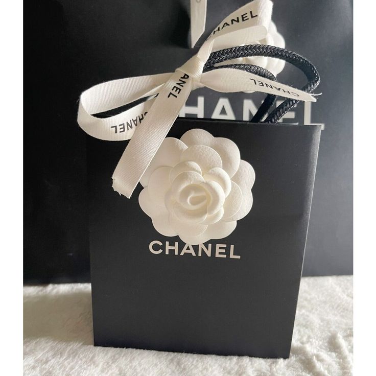 CHANEL Empty Gift Packaging Bundle Gift Bag W/ Flower & Ribbon NEW. CHANEL Empty Gift Packaging Bundle Total 1 Paper Bags, 1 White Flower, 1 - Ribbon Chanel gift bag (Approximately 5 1/2” x 6 1/2) Ribbon White Flower Thank you for stopping by. Chanel Shopping Bag, Chanel Mini Bag, Chanel Shopping, Chanel Tote Bag, Chanel Chain, Chanel Store, Hand Photo, Sunglasses Logo, Chanel Tote