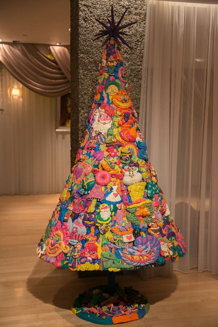 a brightly colored christmas tree is on display