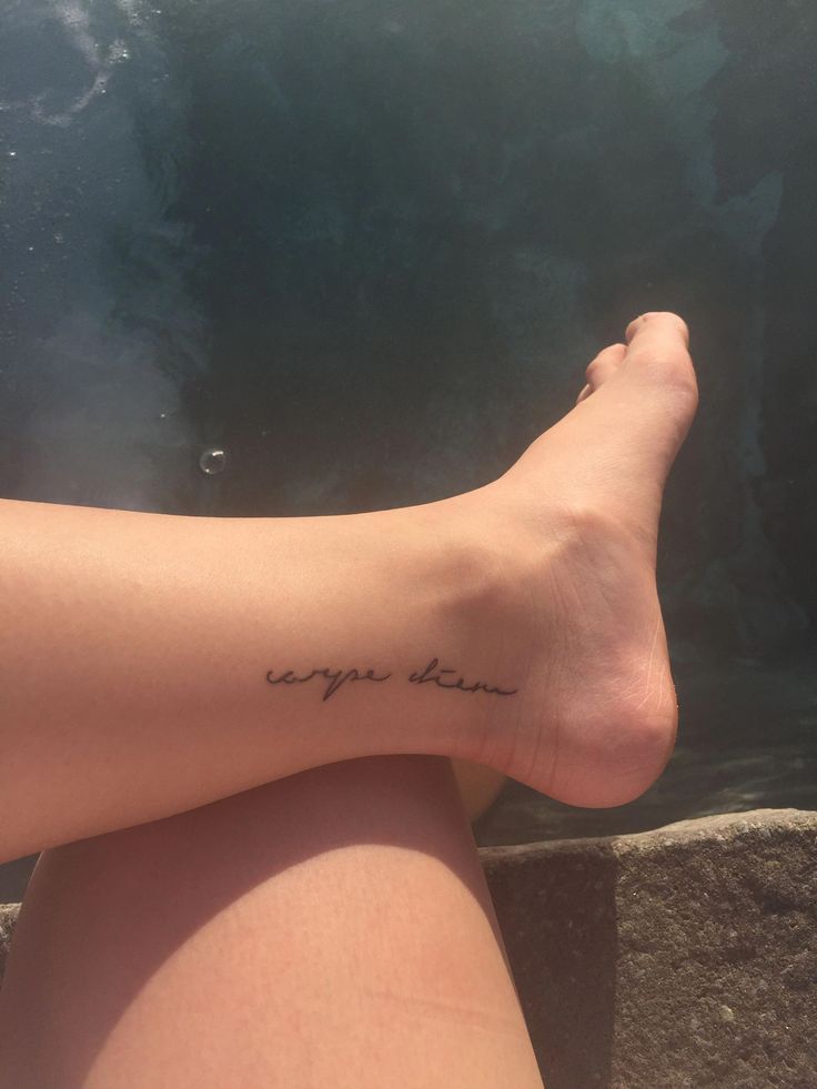 a woman's foot with the words you are loved written on her left leg