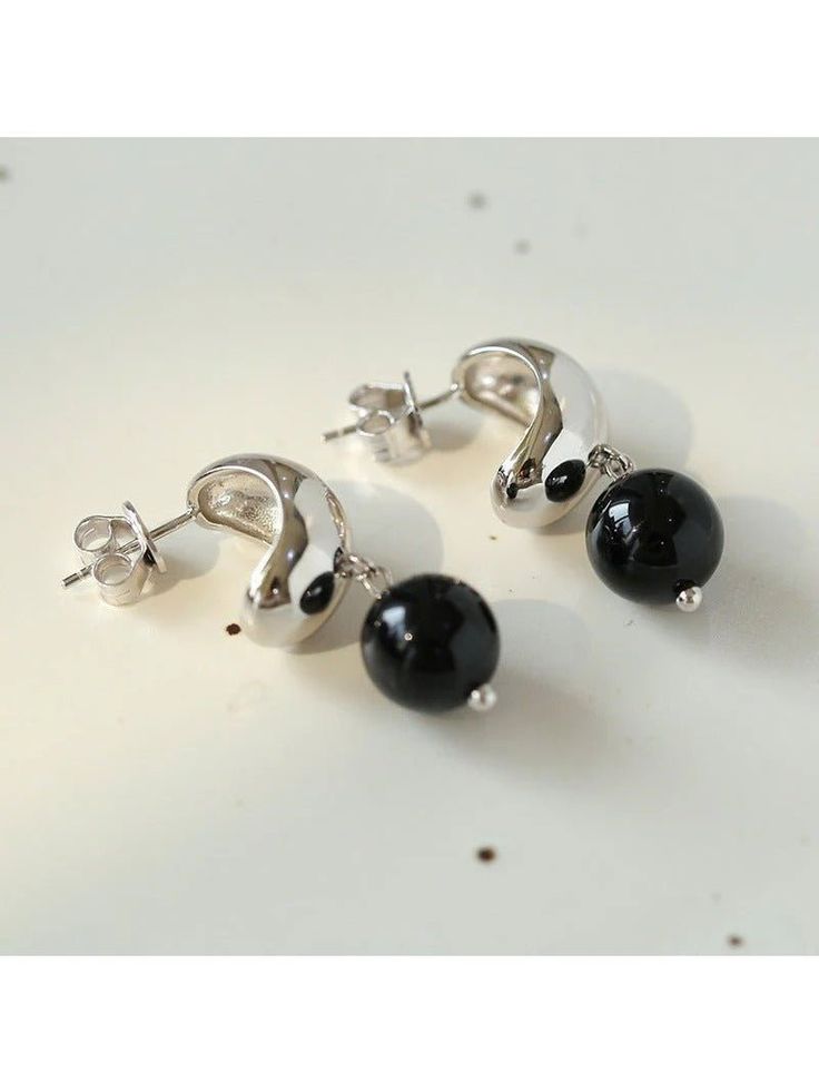 Elevate your style with the bold sophistication of our Sterling Silver Black Onyx Earrings—a chic and versatile accessory that seamlessly combines the timeless beauty of sterling silver with the captivating allure of black onyx. Metal: 925 Sterling Silver Gemstone: Black Onyx Earrings Dimensions: 30mm Single Weight: 3.5g Everyday Silver Onyx Jewelry, Elegant Everyday Jewelry With Black Enamel, Elegant Black Drop Jewelry, Elegant Everyday Black Enamel Jewelry, Elegant Black Sterling Silver Jewelry, Elegant Sterling Silver Jewelry With Black Enamel, Black Polished Finish Earrings For Evening, Elegant Onyx Jewelry For Everyday, Elegant Single Black Earring