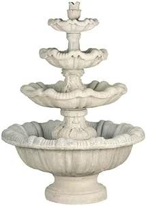 a white water fountain with three tiers