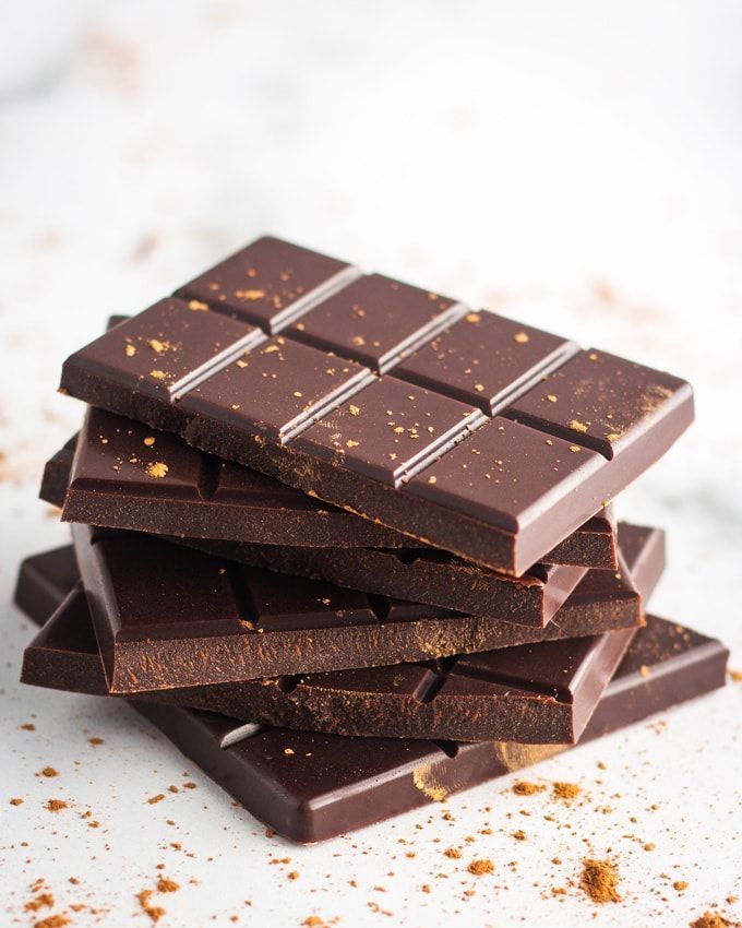 a stack of chocolate bars sitting next to each other on top of a white counter