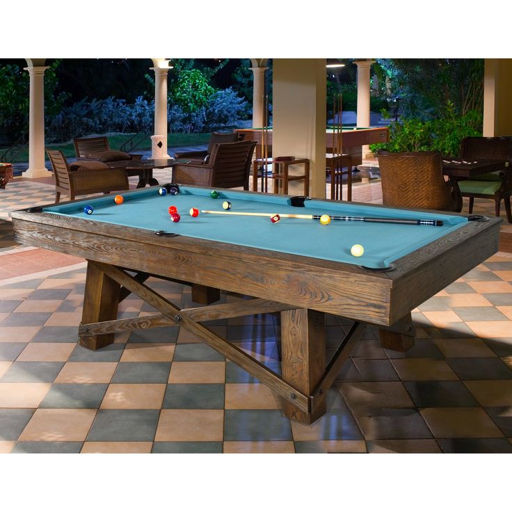 a pool table in the middle of a patio