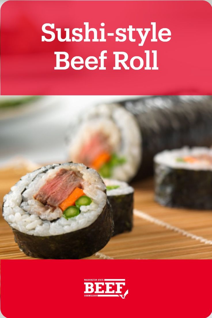 sushi - style beef roll with carrots and celery on the side