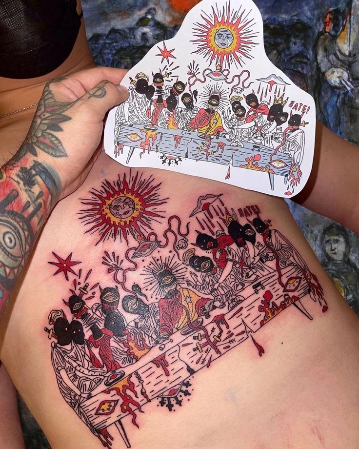 a woman with tattoos on her stomach holding up a piece of paper that has an image of mickey mouse