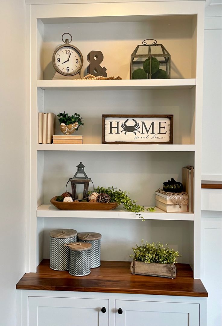 the shelves in this room are filled with books and other things to put on them