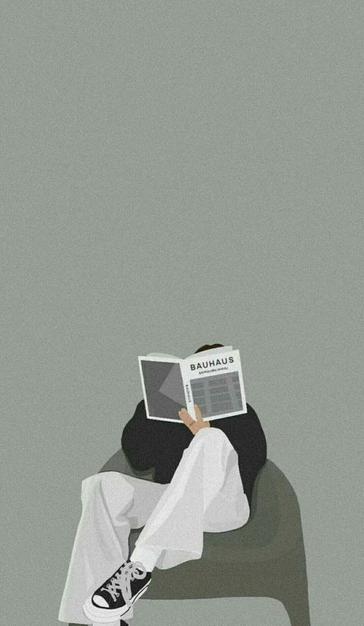 a person sitting on a chair with a book in their lap and reading the newspaper