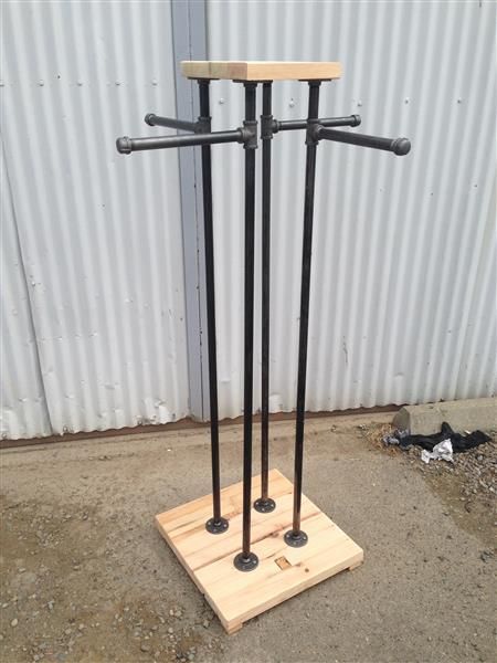 a pair of black metal poles sitting on top of a wooden platform