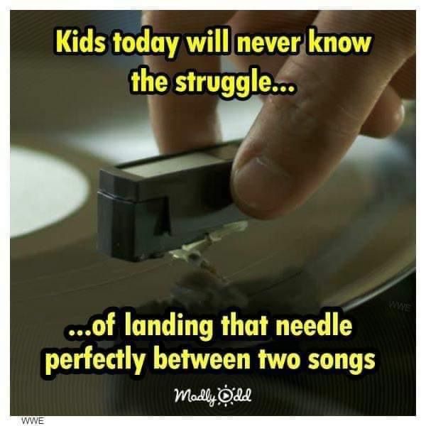 a person touching a record on top of a turntable with the words kids today will never know the struggle off landing that needle perfectly between two songs