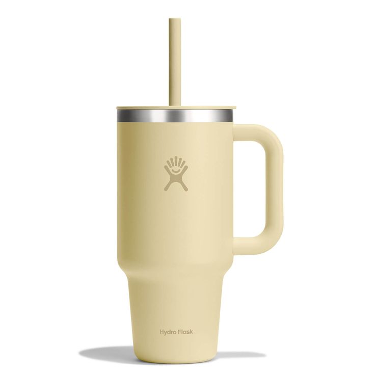 the tumbler cup has a straw in it's handle and is light yellow